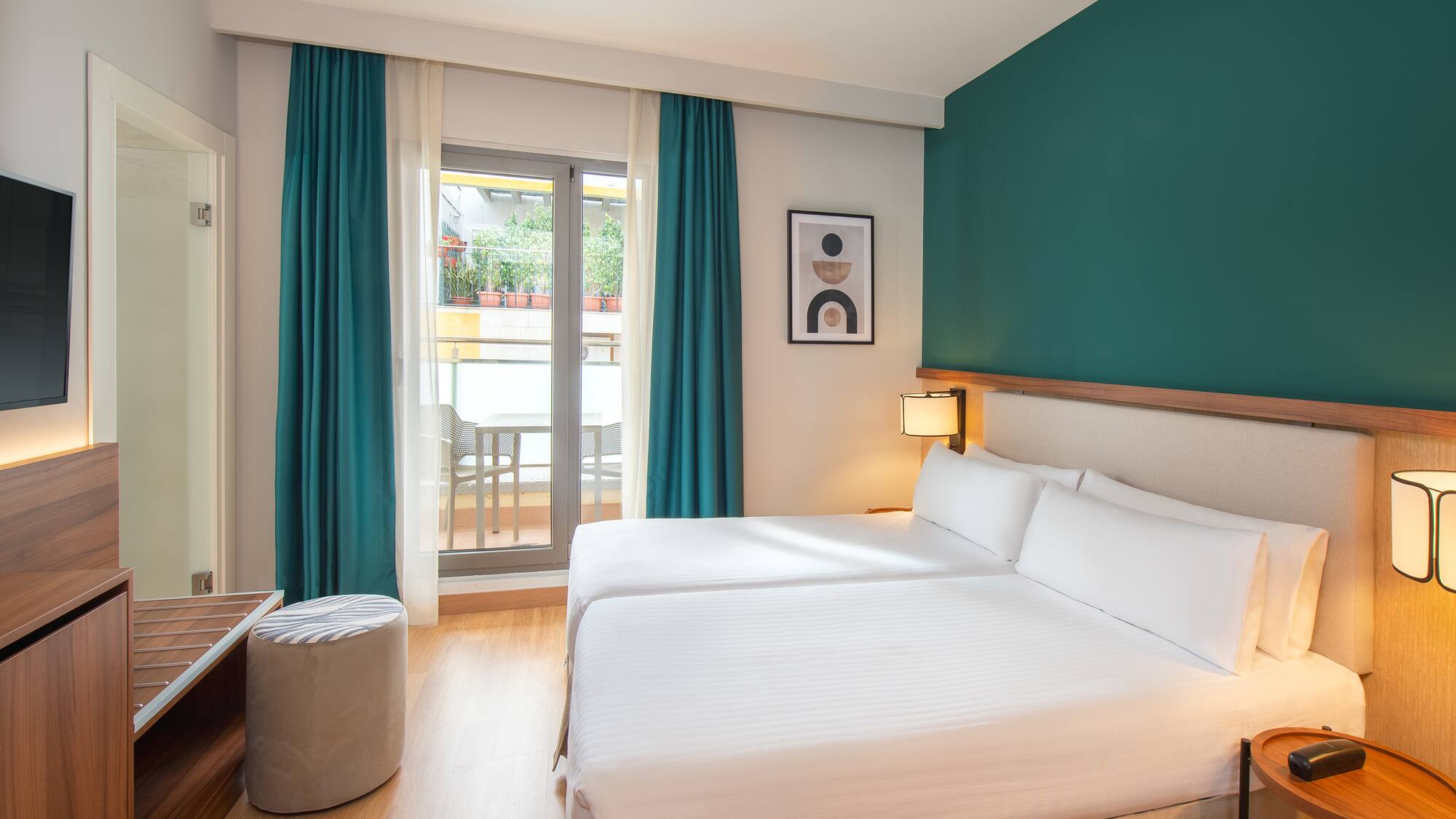 a room with two beds and a table