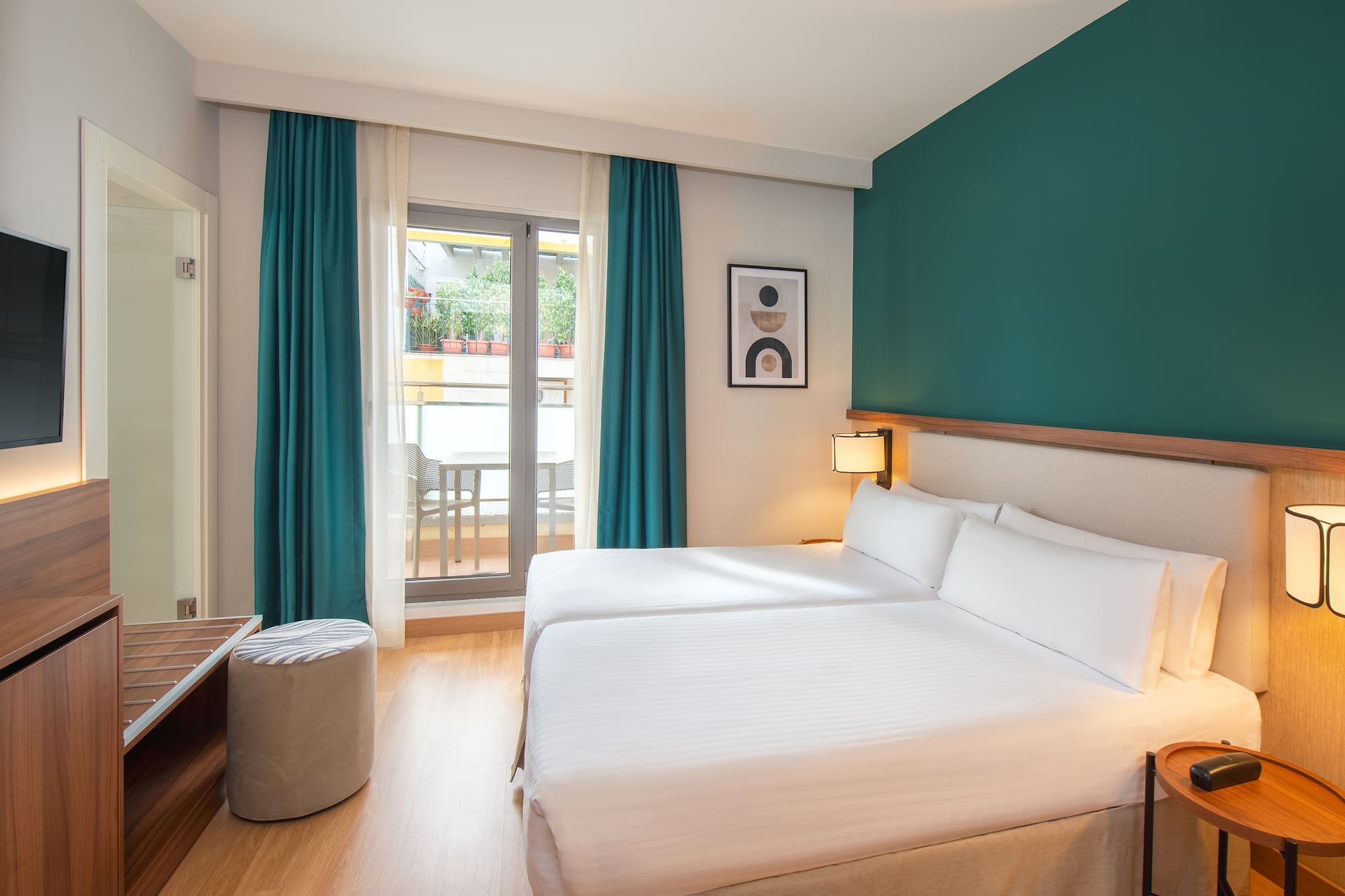 a room with two beds and a table