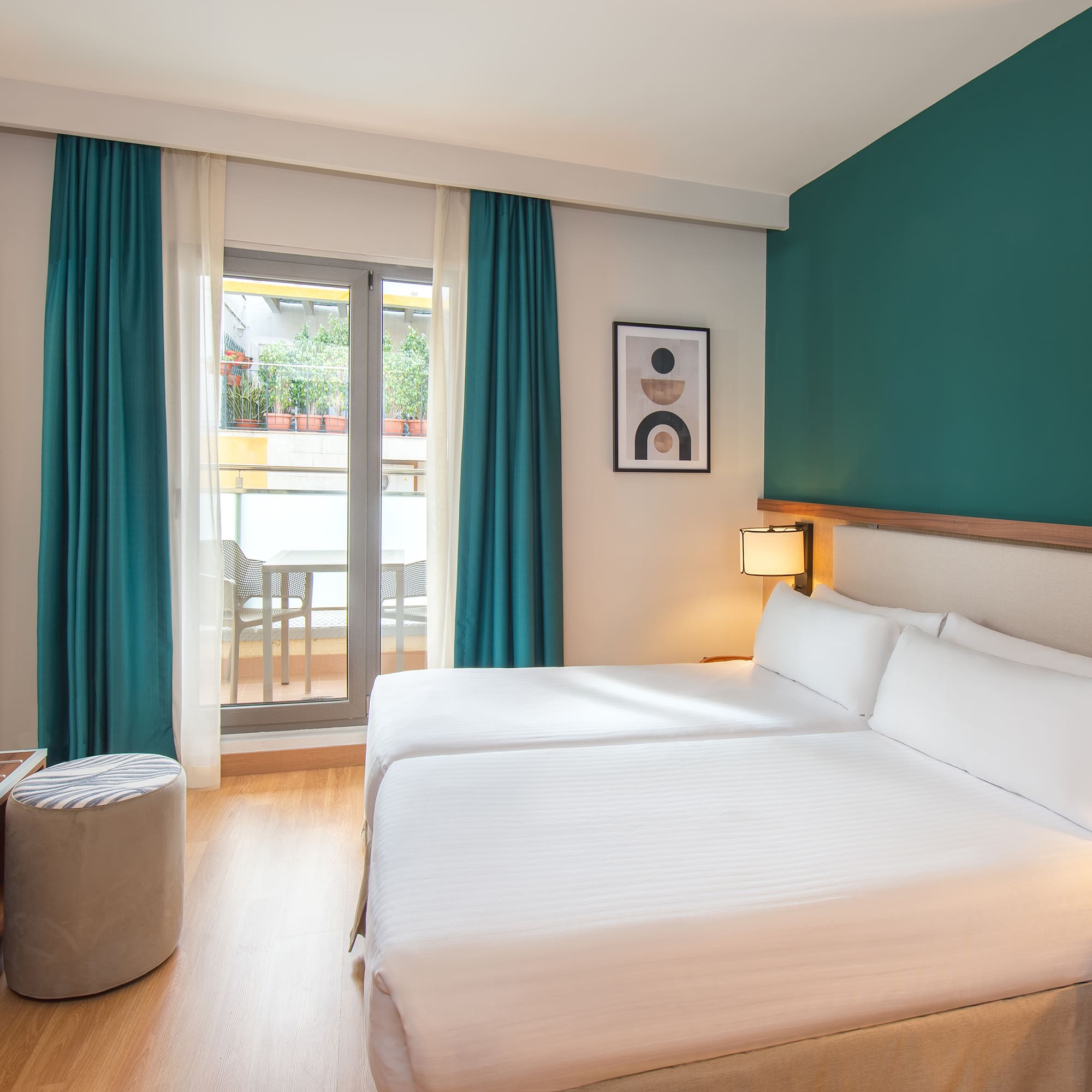 a room with two beds and a table