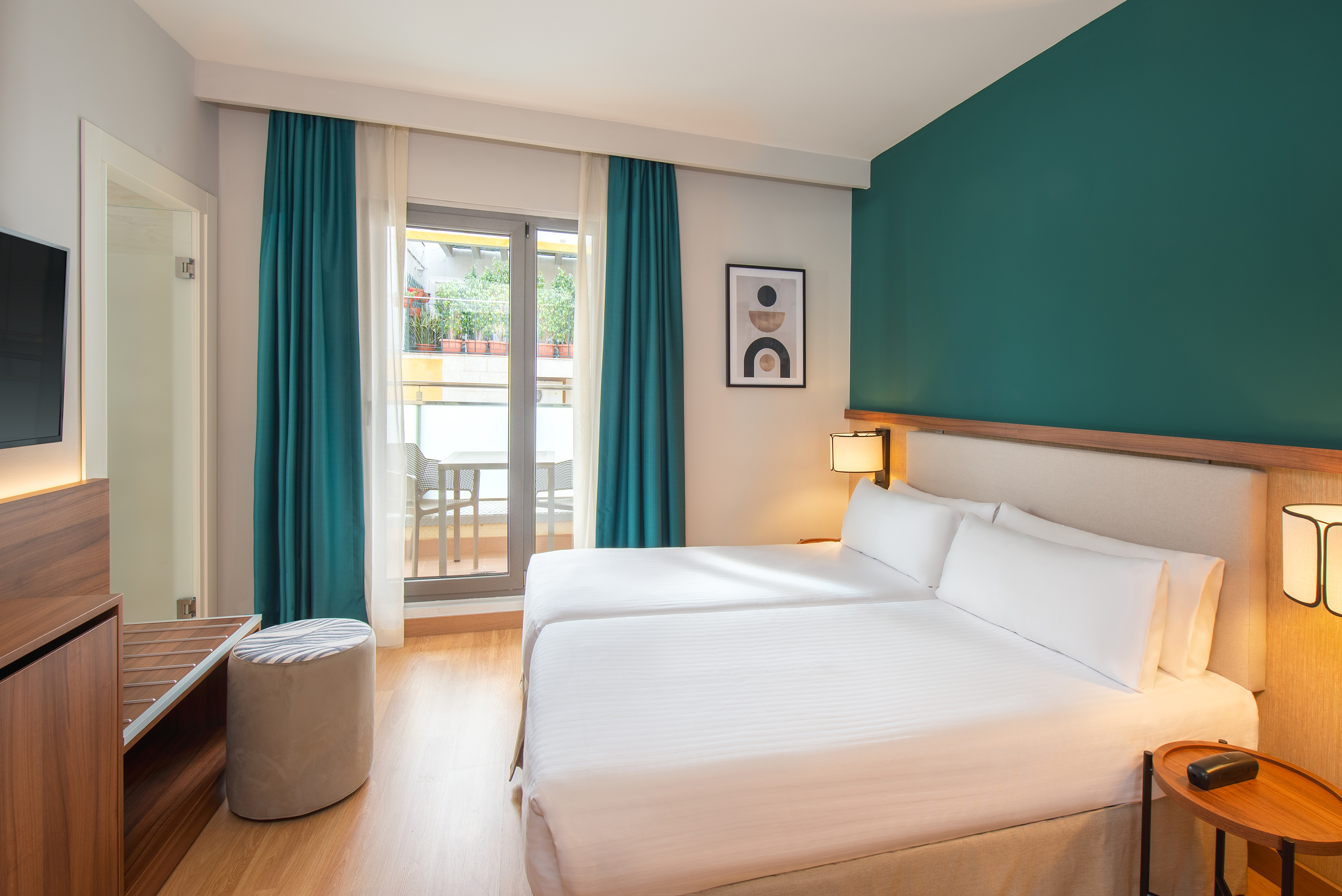 a room with two beds and a table