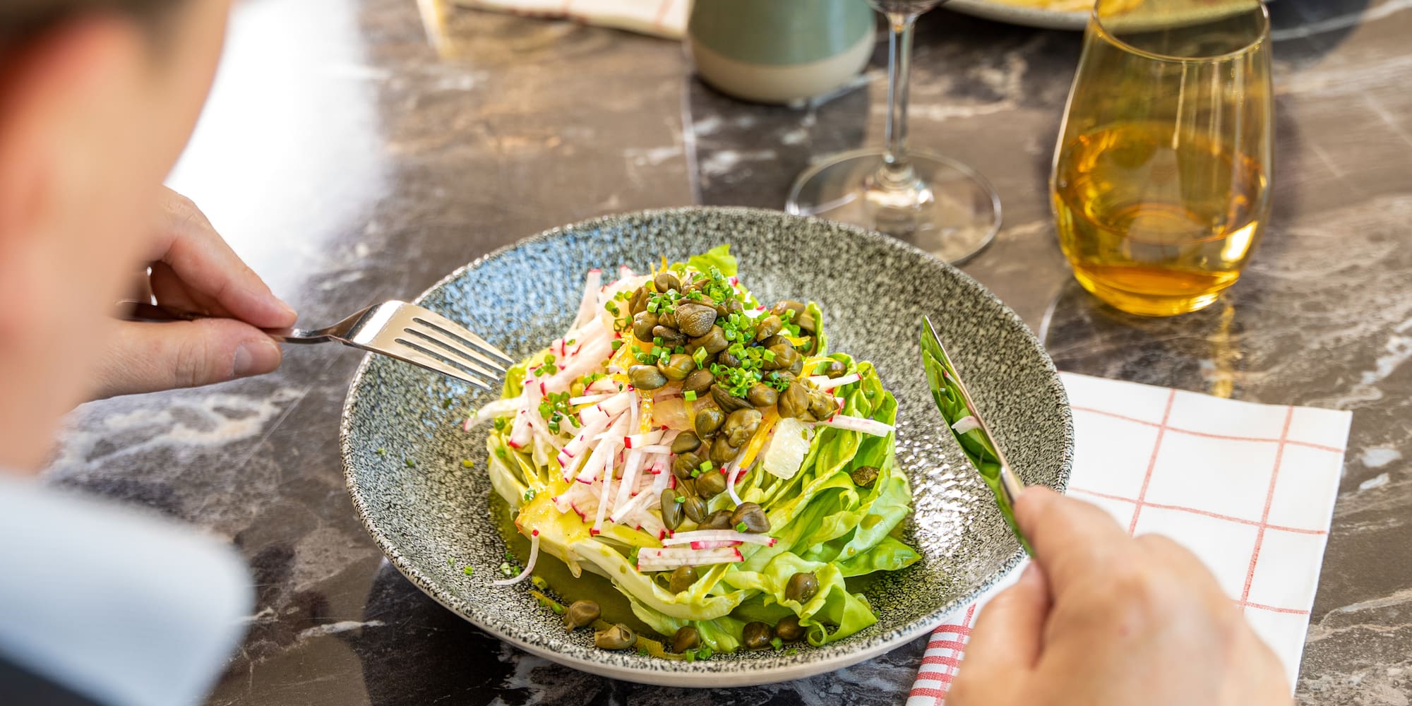 a person eating a salad