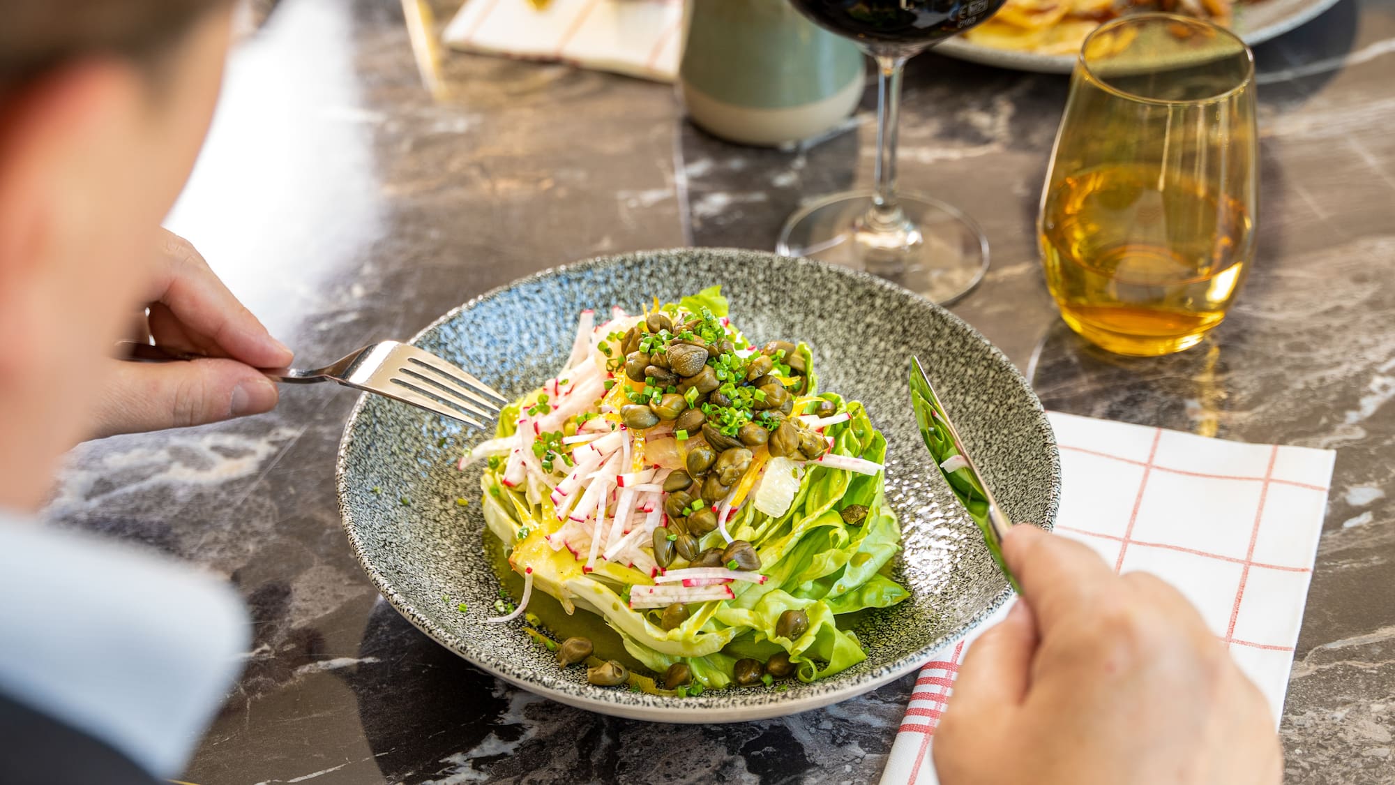 a person eating a salad