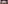 Modern ME hotel entrance, illuminated sign, glass facade, marble pillars at dusk.