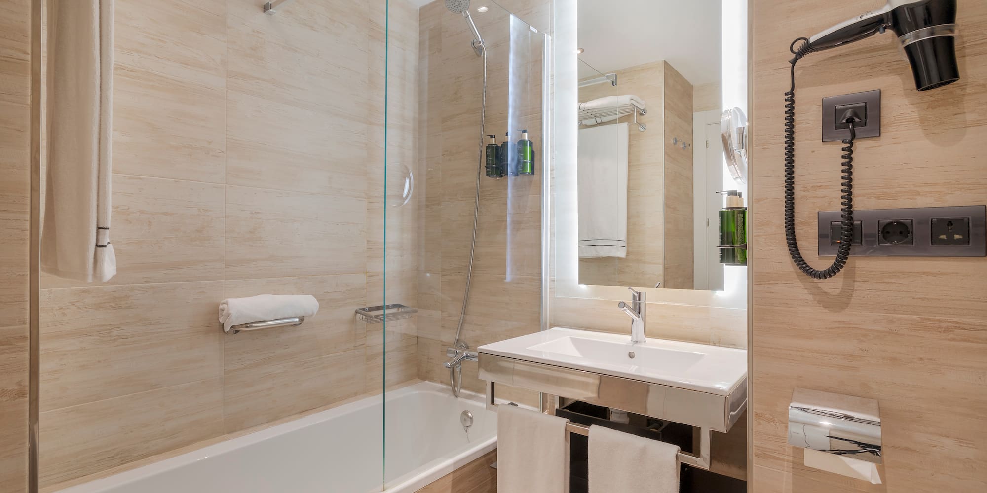 a bathroom with a glass shower door