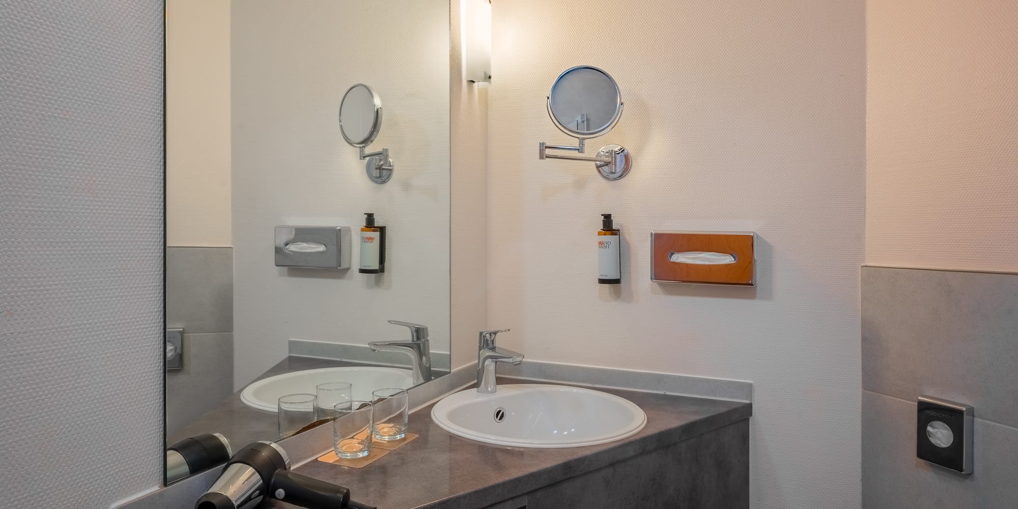 a bathroom with a sink and mirror