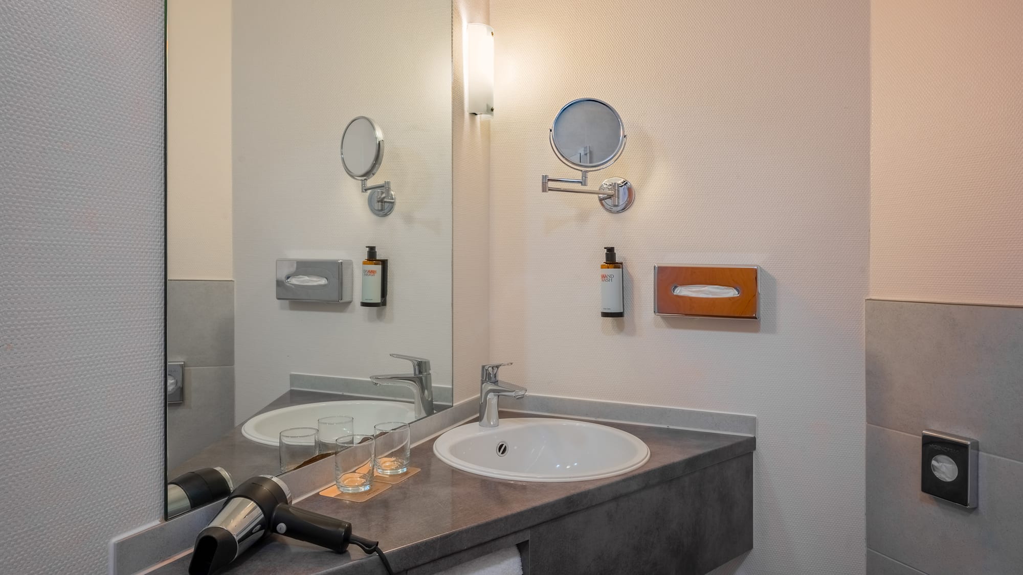 a bathroom with a sink and mirror