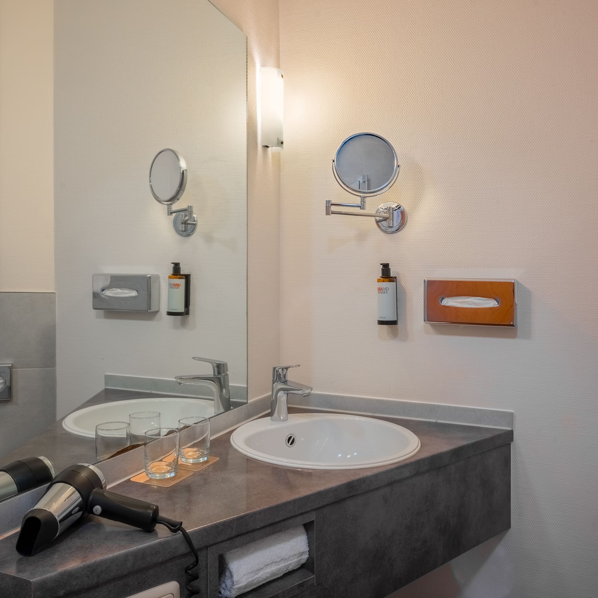 a bathroom with a sink and mirror