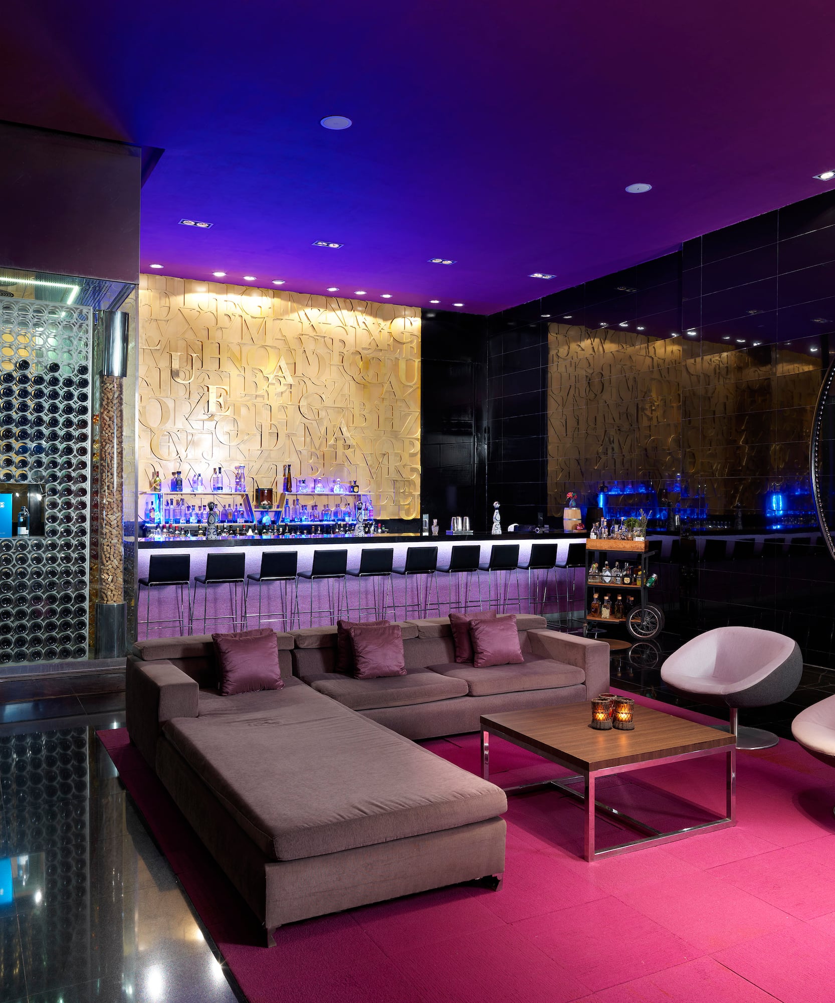 a room with a bar and a couch