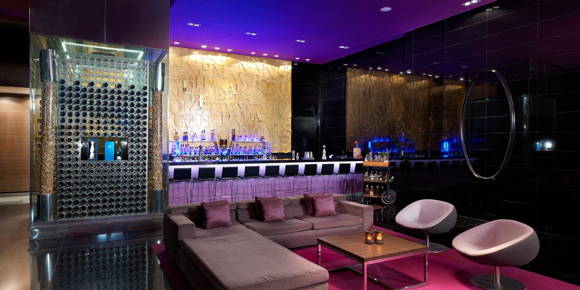 a room with a bar and a couch