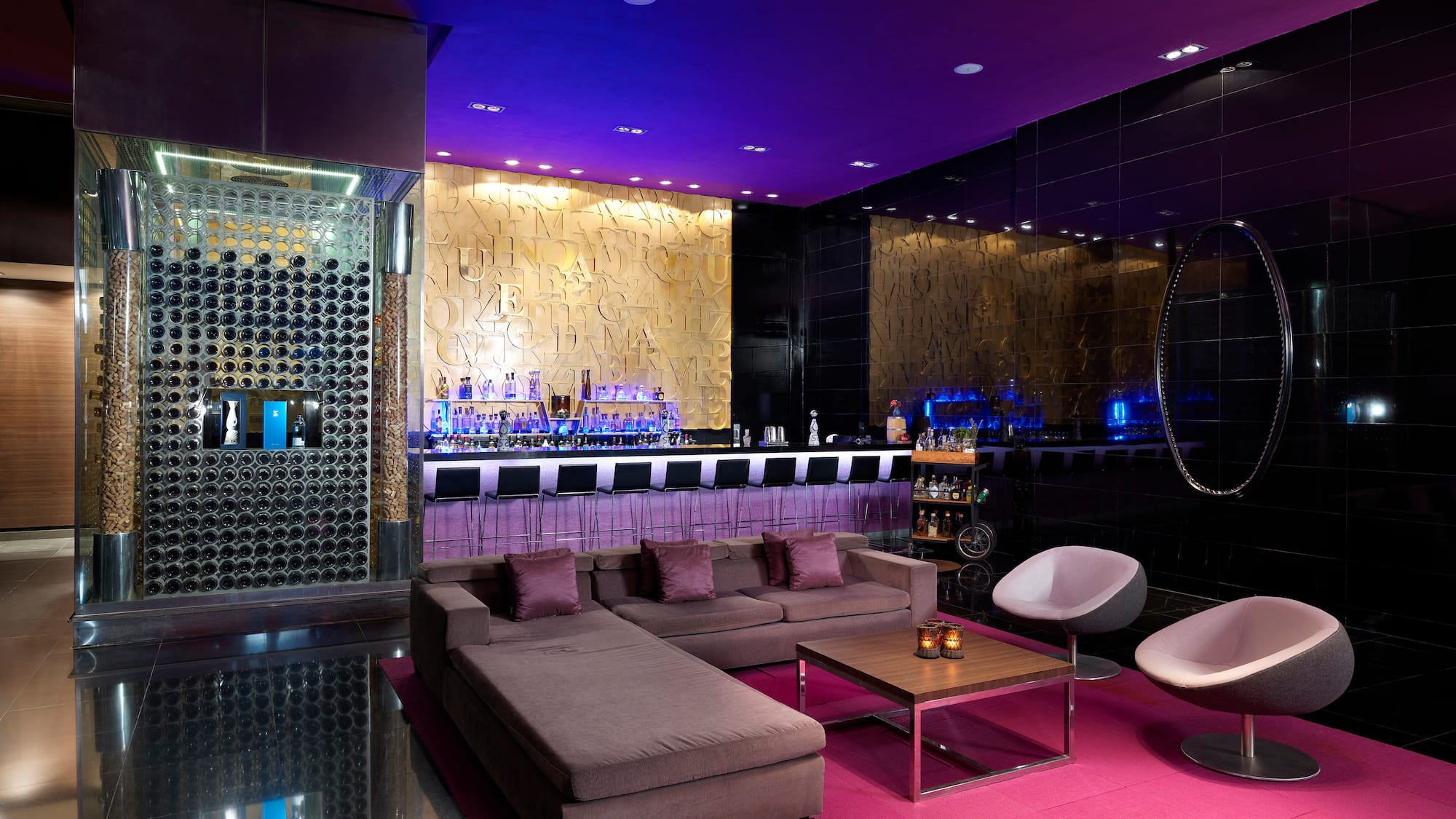 a room with a bar and a couch