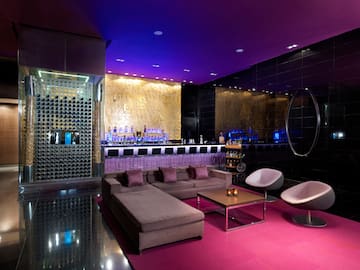 a room with a bar and a couch