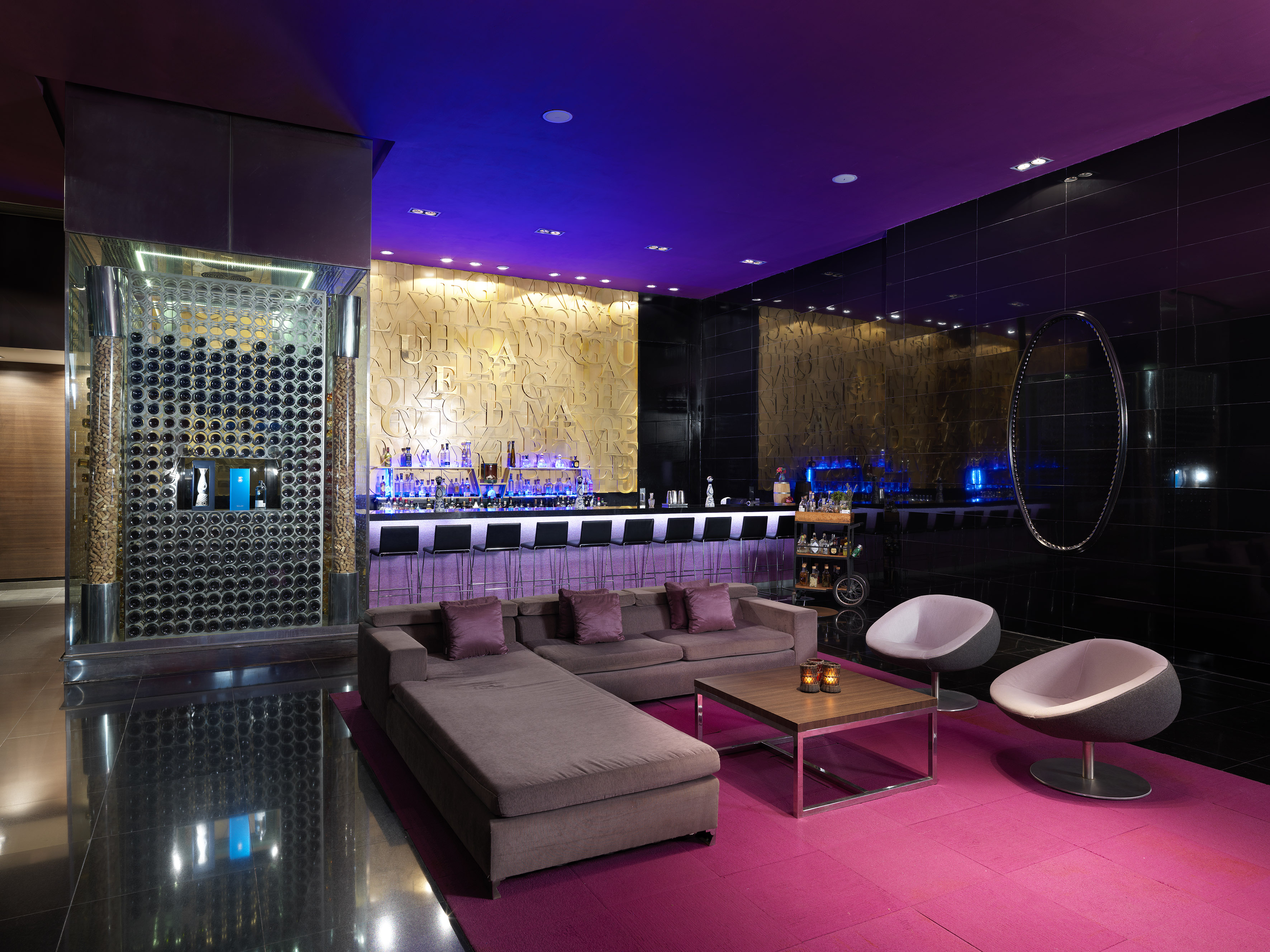 a room with a bar and a couch