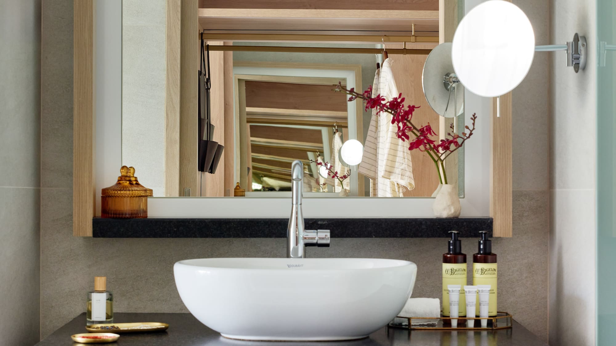 a bathroom with a sink and mirror