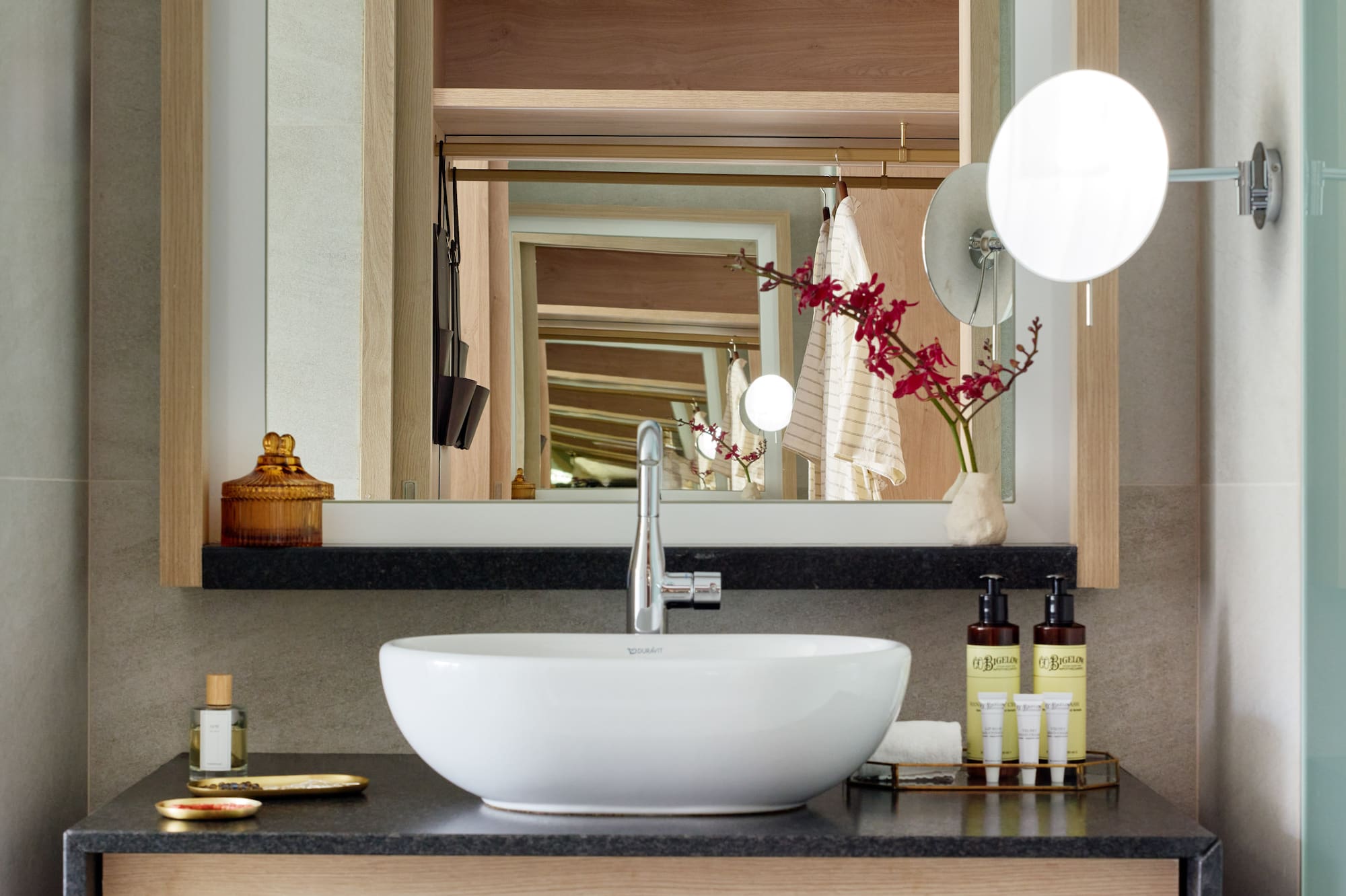 a bathroom with a sink and mirror