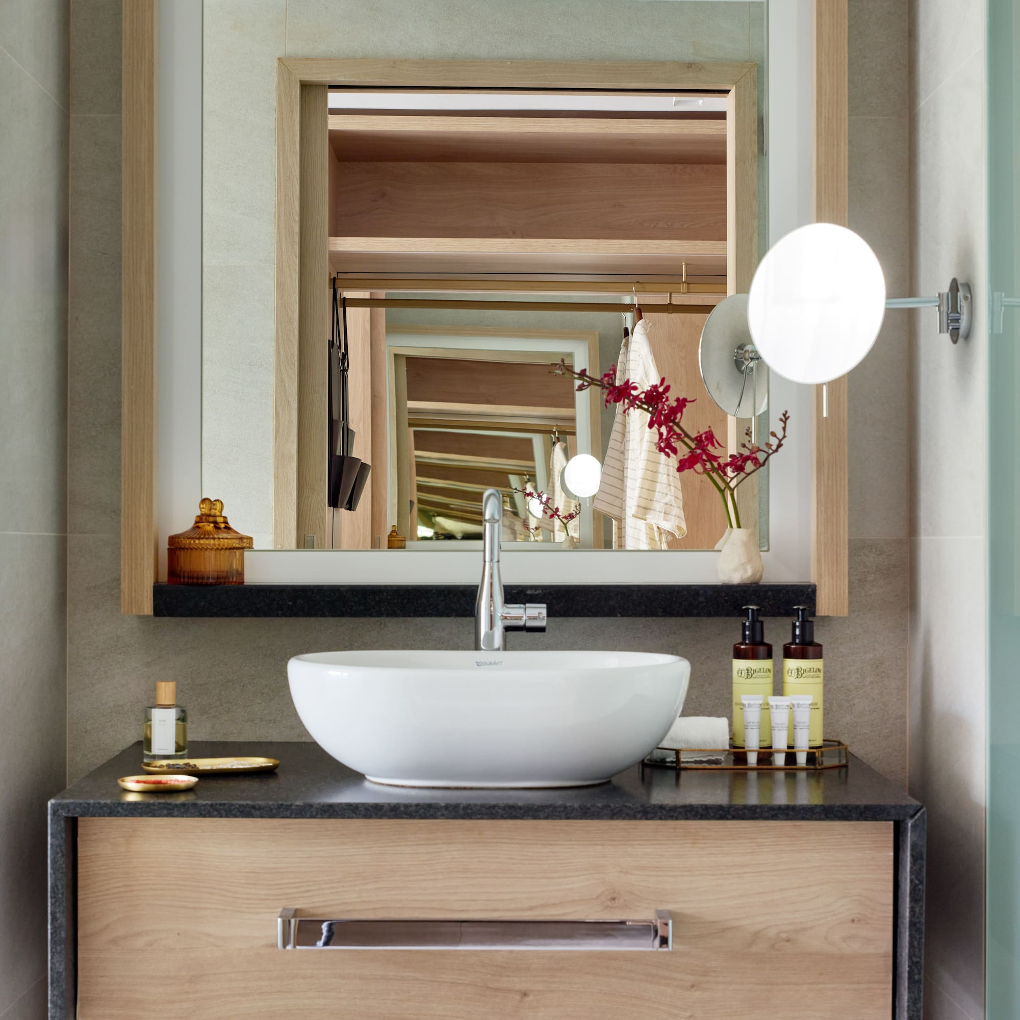 a bathroom with a sink and mirror