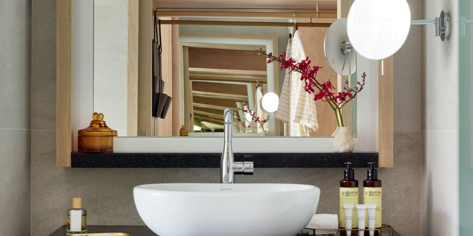 a bathroom with a sink and mirror