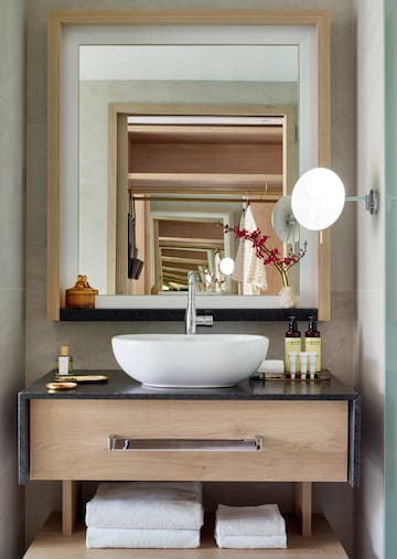a bathroom with a sink and mirror