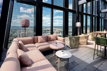 a room with a large window and a couch