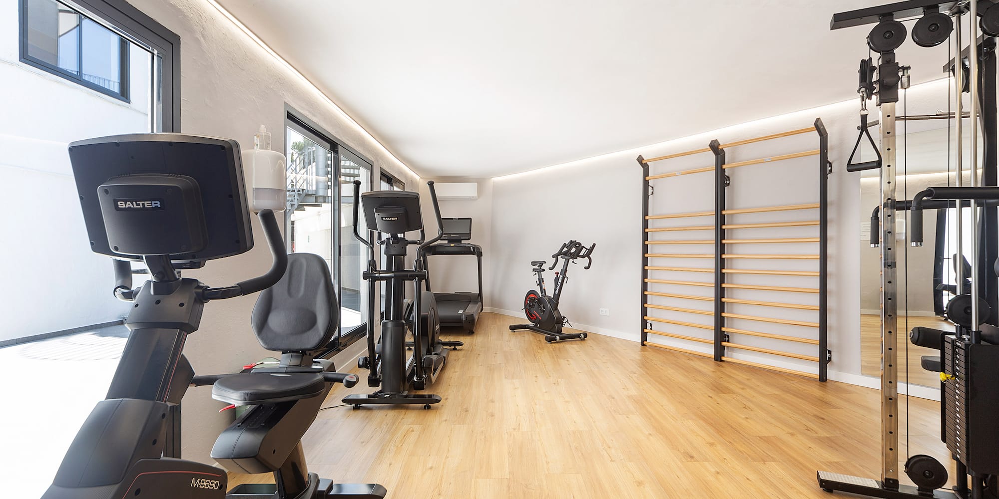 a room with exercise bikes and exercise equipment