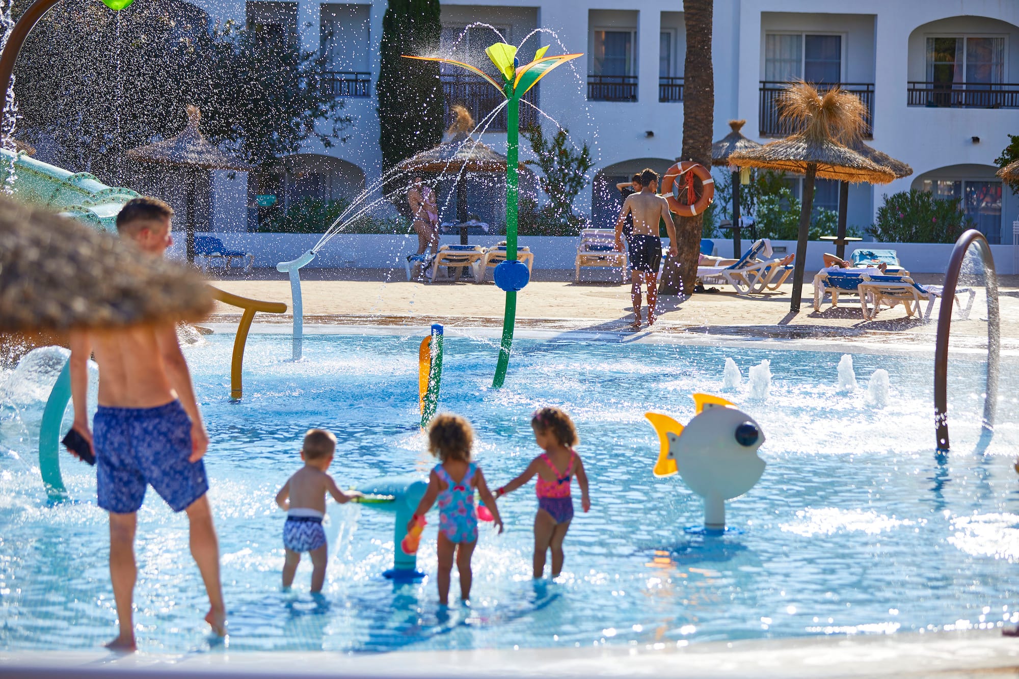 a group of kids in a pool