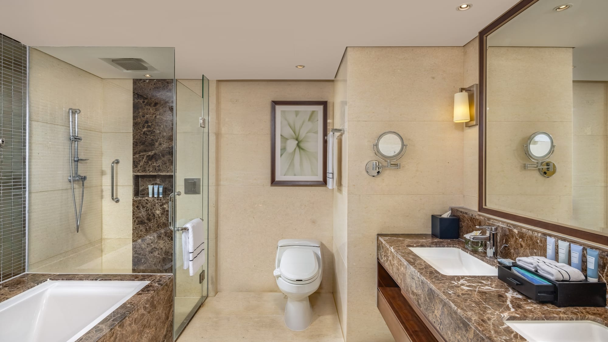 a bathroom with marble countertops and a sink
