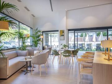 a room with tables and chairs and a couch