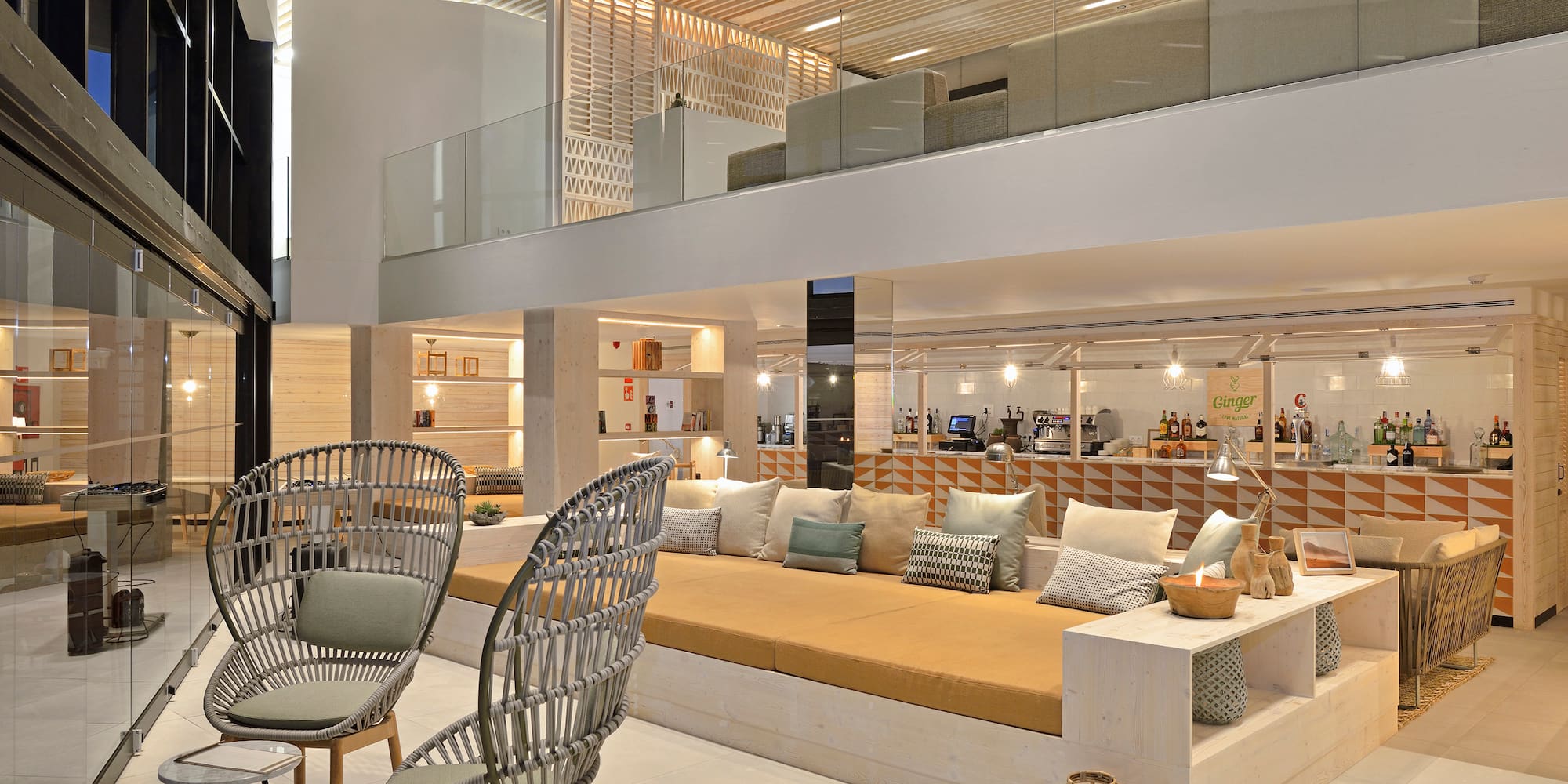 a room with a couch and chairs