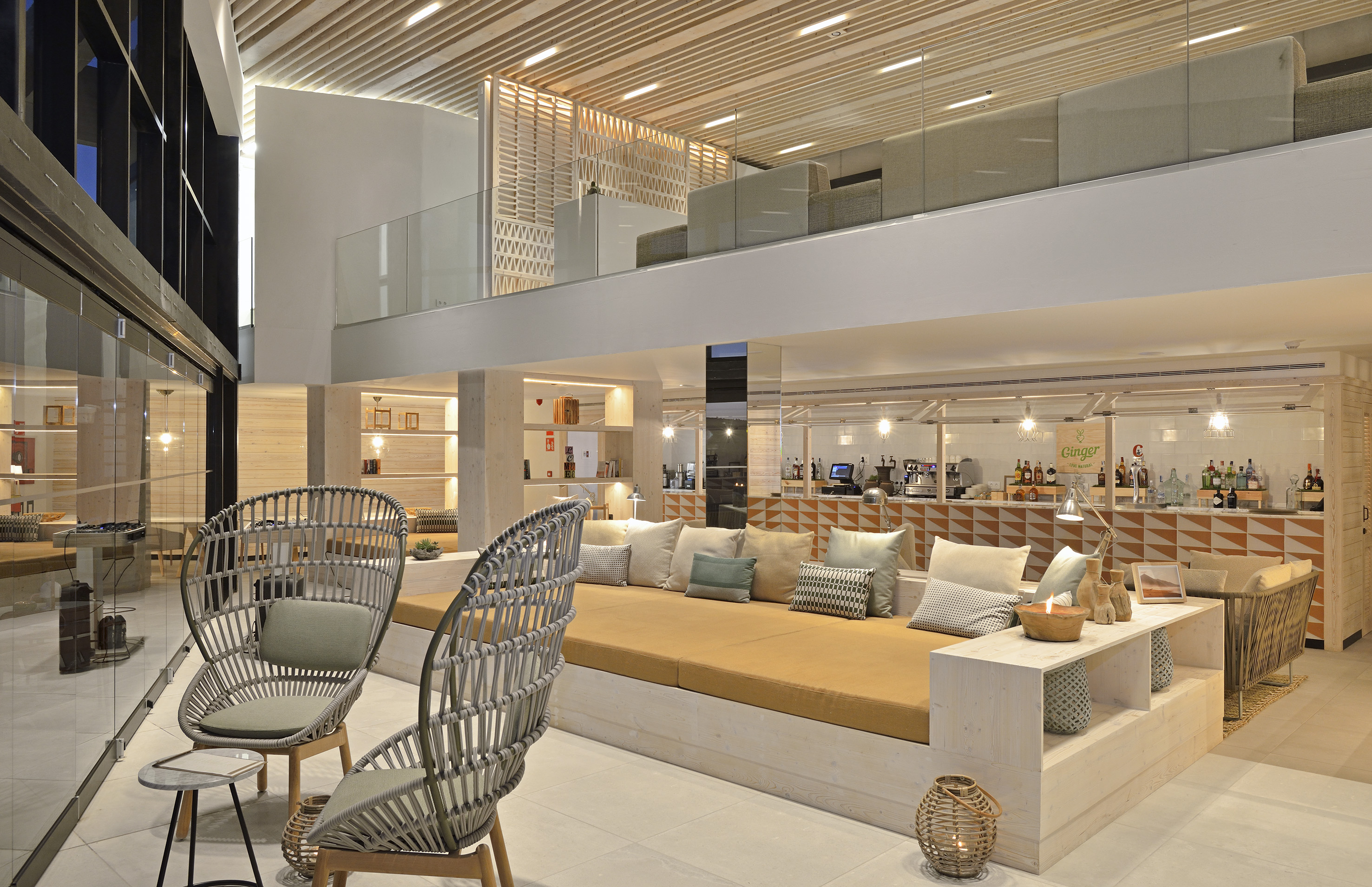 a room with a couch and chairs