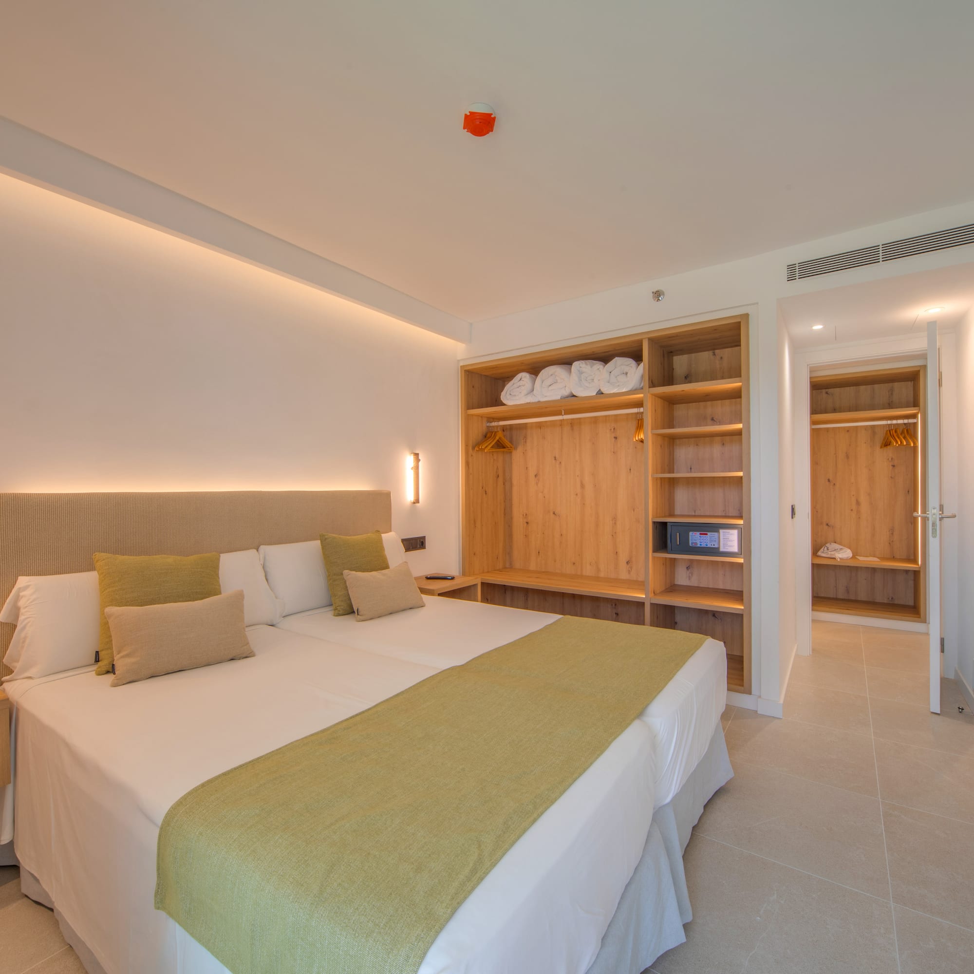 a room with a bed and shelves