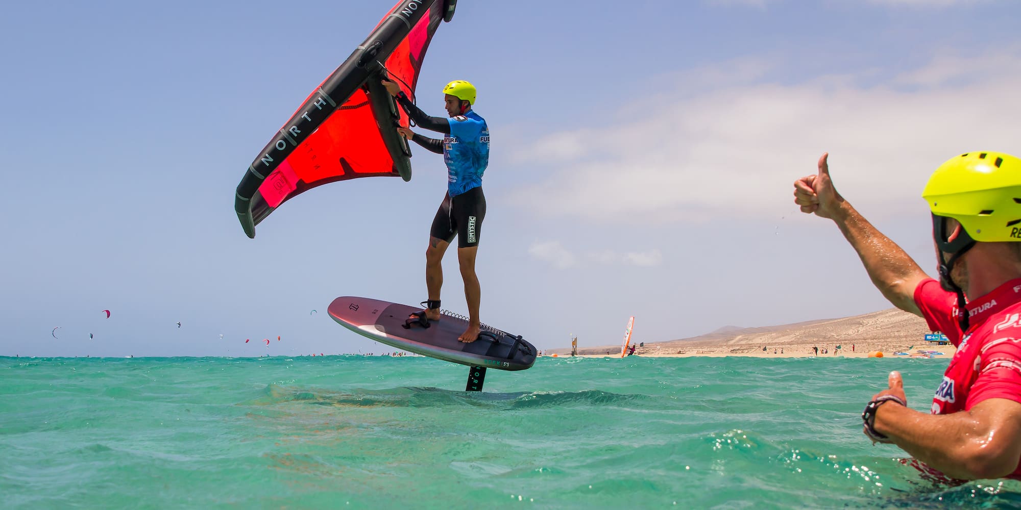 a man on a surfboard in the water