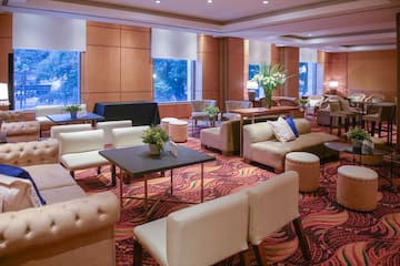 a room with couches and tables