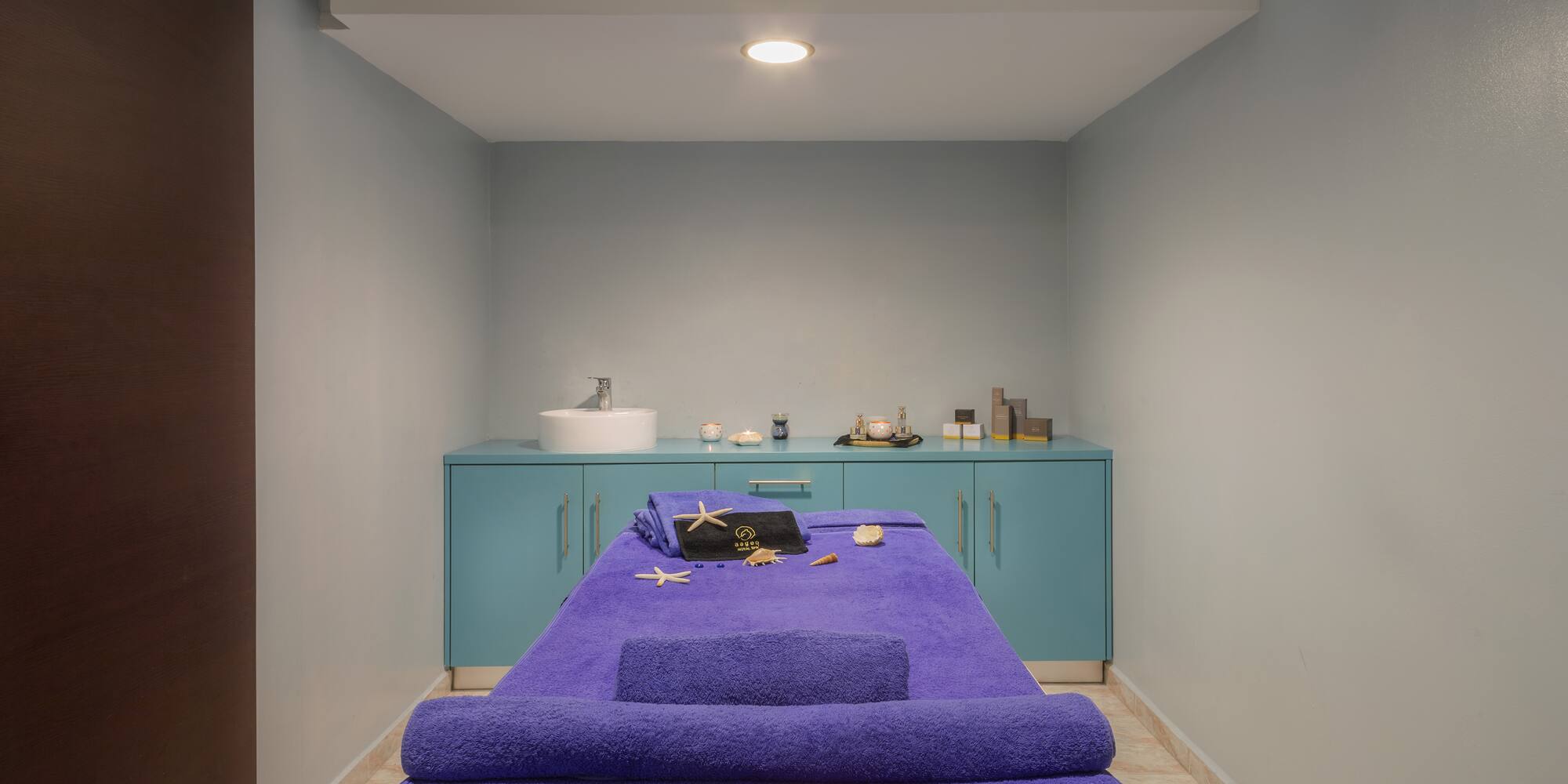 a massage table with towels and a towel on it