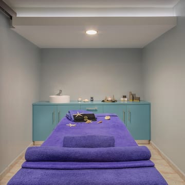 a massage table with towels and a towel on it