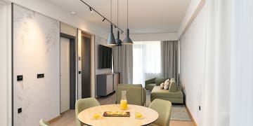 a room with a table and chairs