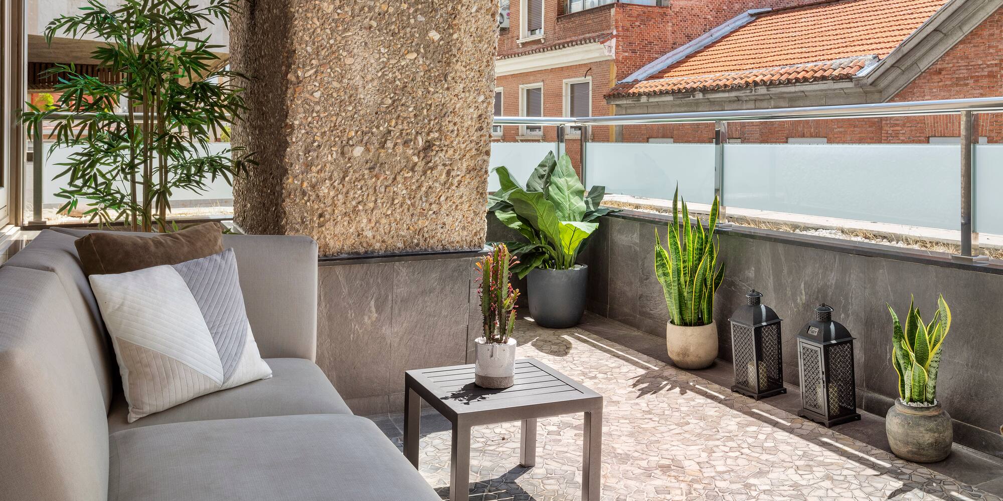 a couch and a table on a patio