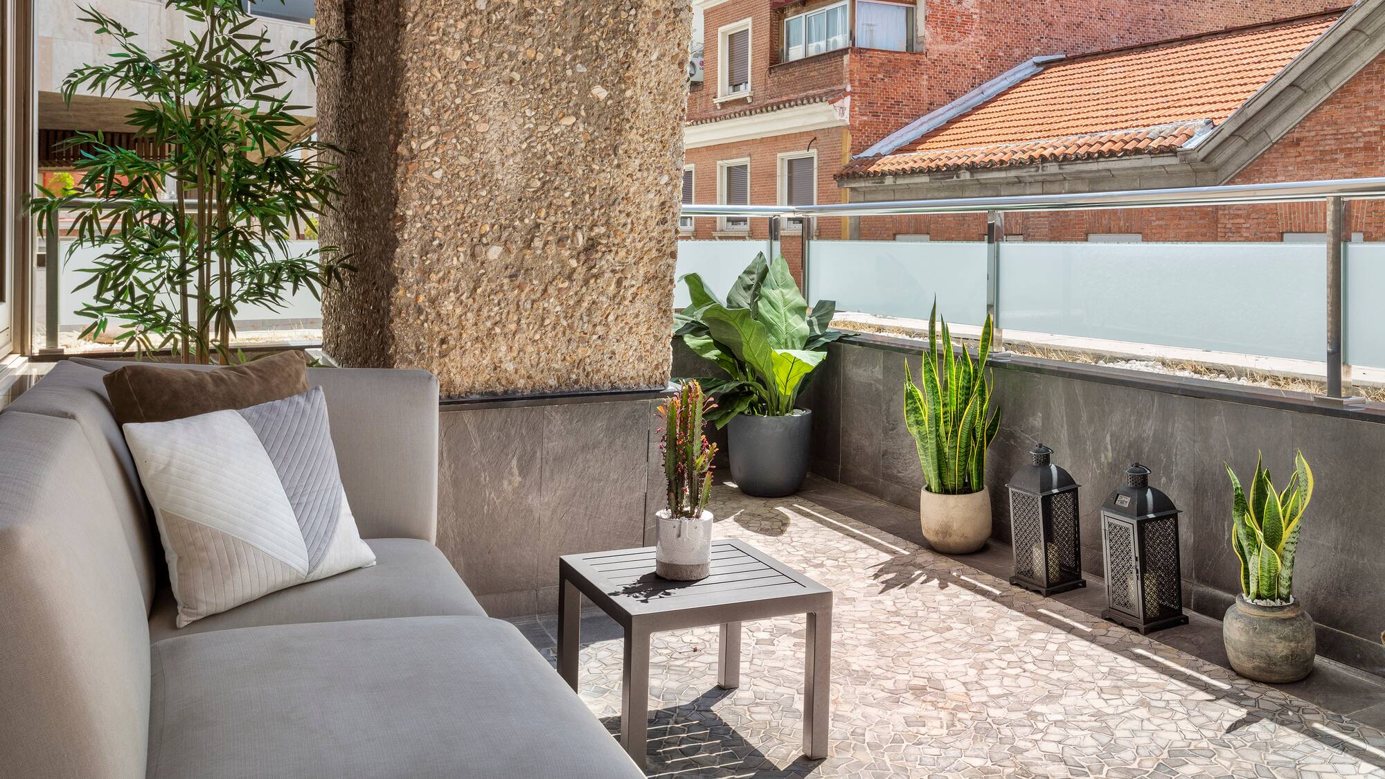 a couch and a table on a patio