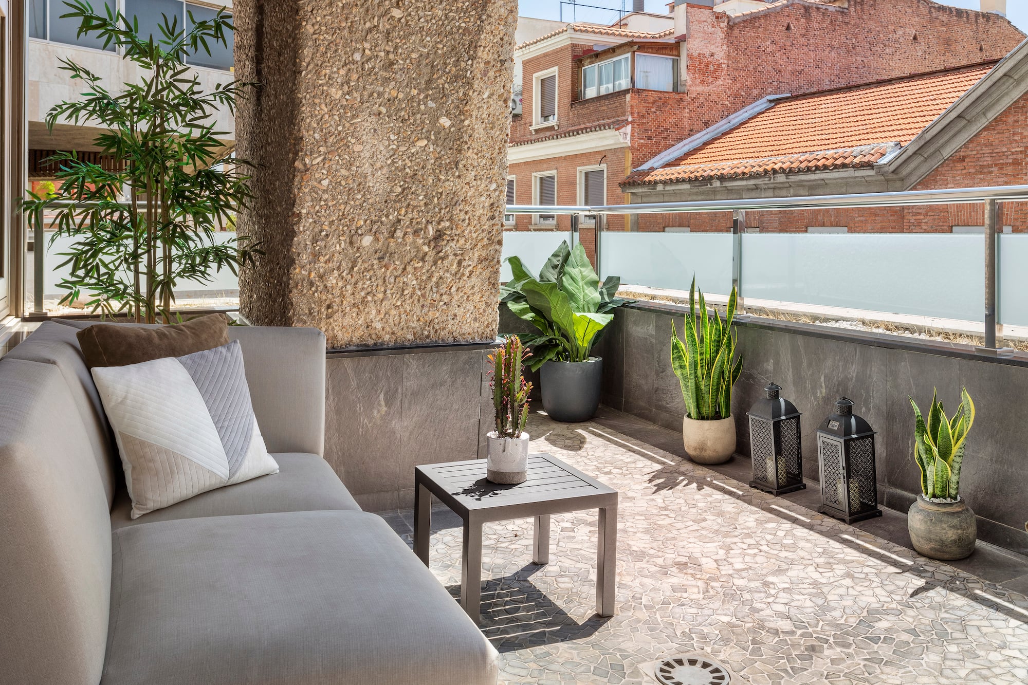 a couch and a table on a patio