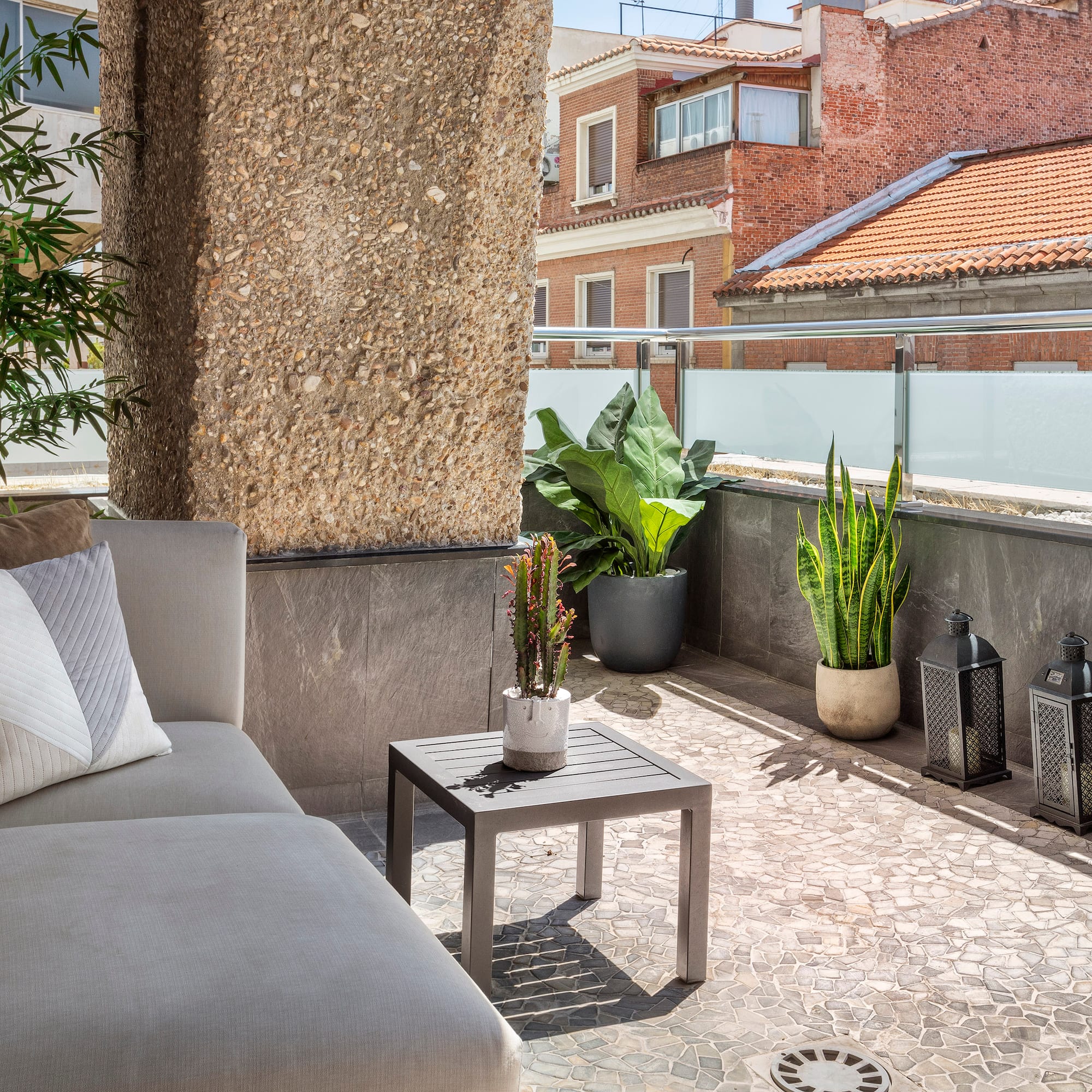 a couch and a table on a patio