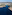 Pueblo costero en Mallorca con cala de aguas turquesas y villas blancas.