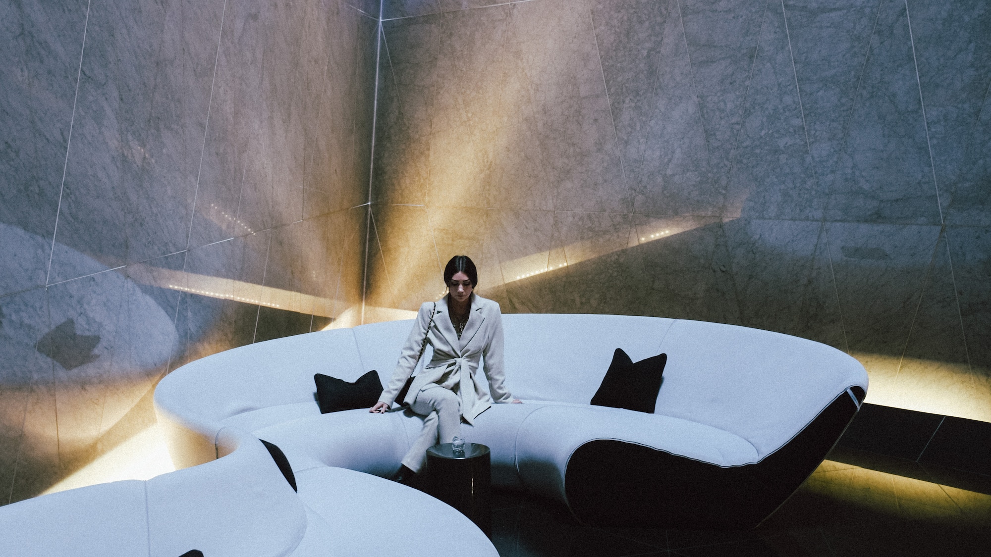 a woman sitting on a white couch