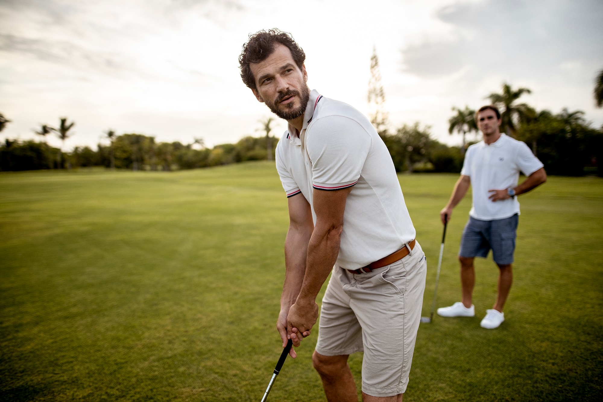 a man holding a golf club