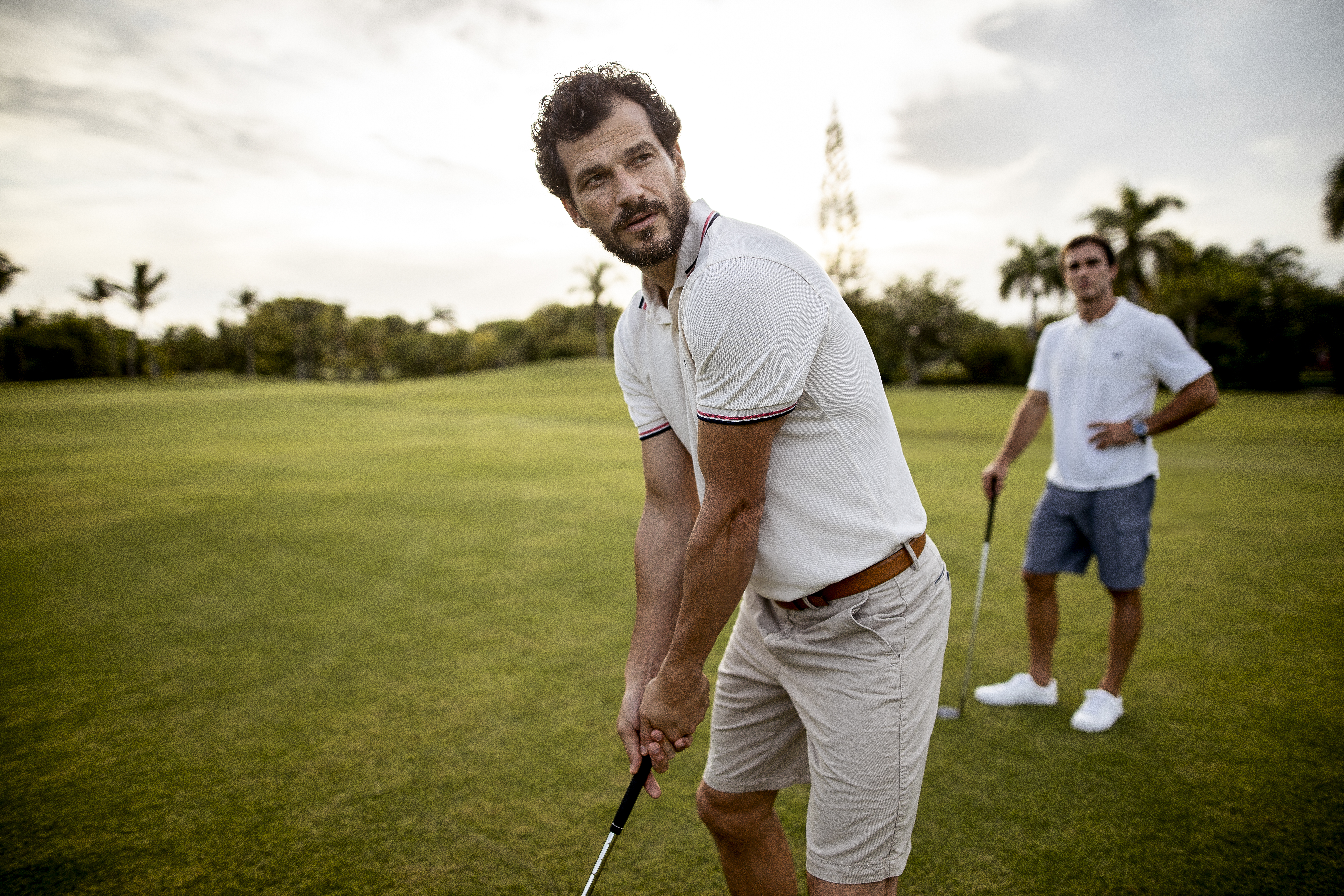 a man holding a golf club