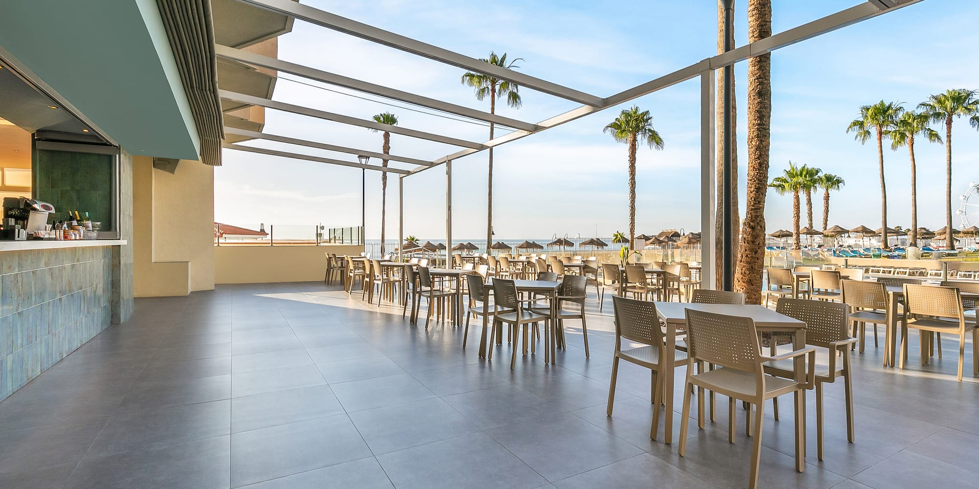 a patio with tables and chairs