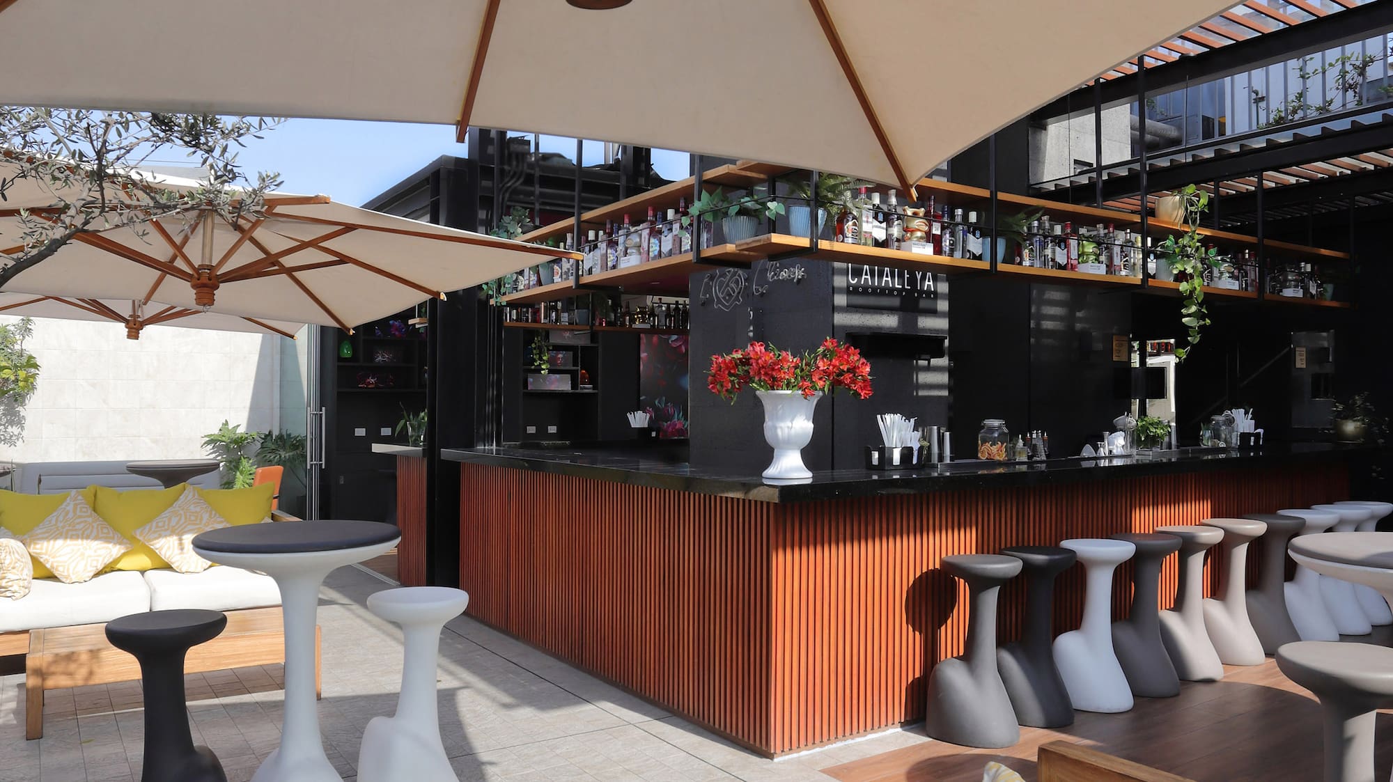 a patio with tables and chairs
