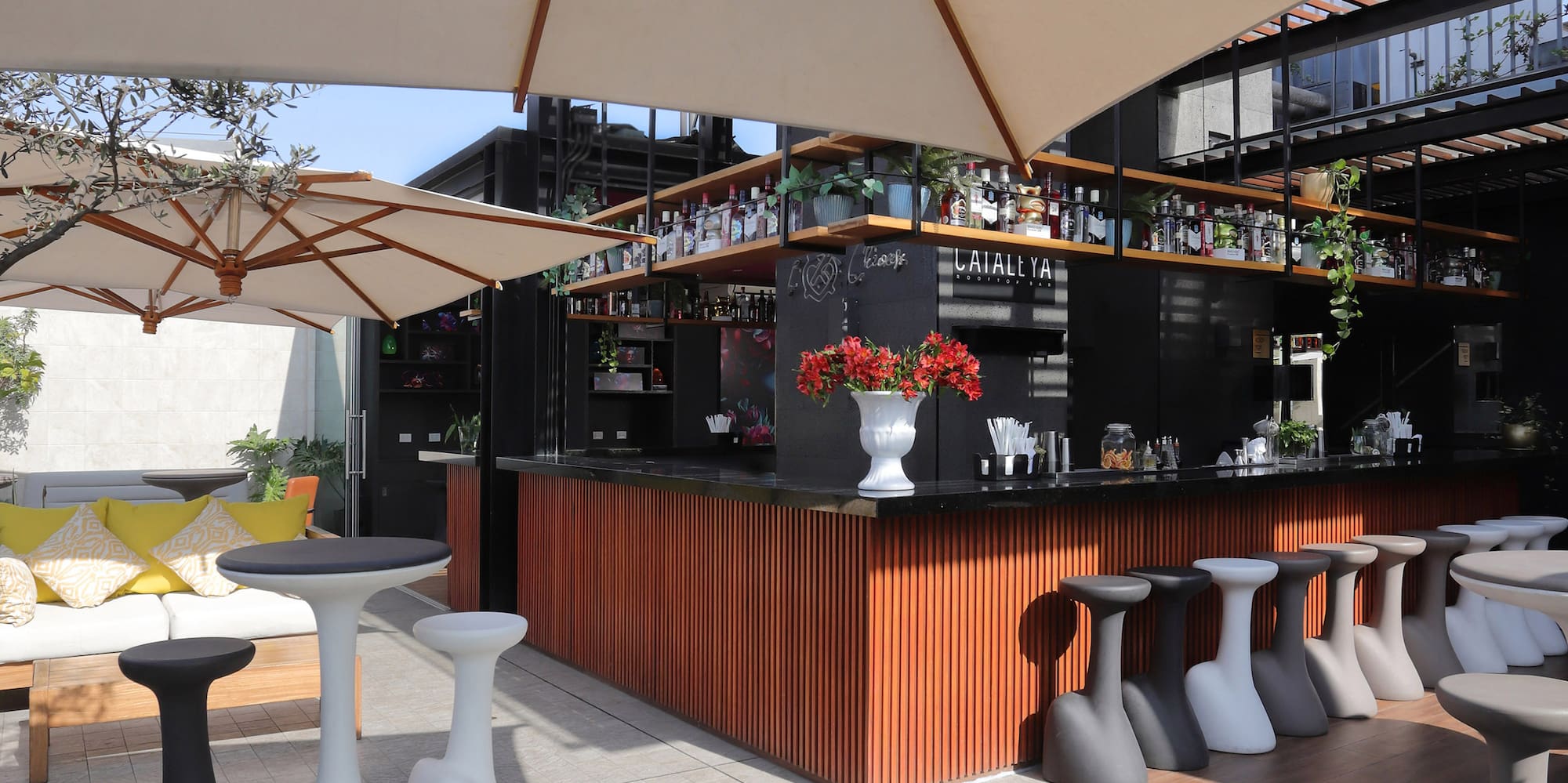 a patio with tables and chairs