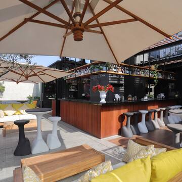 a patio with tables and chairs