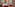 Contemporary hotel room, red chairs, patterned headboard art, city view.