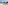 Sunny hotel balcony with sea view, overlooking coastal city and beach.