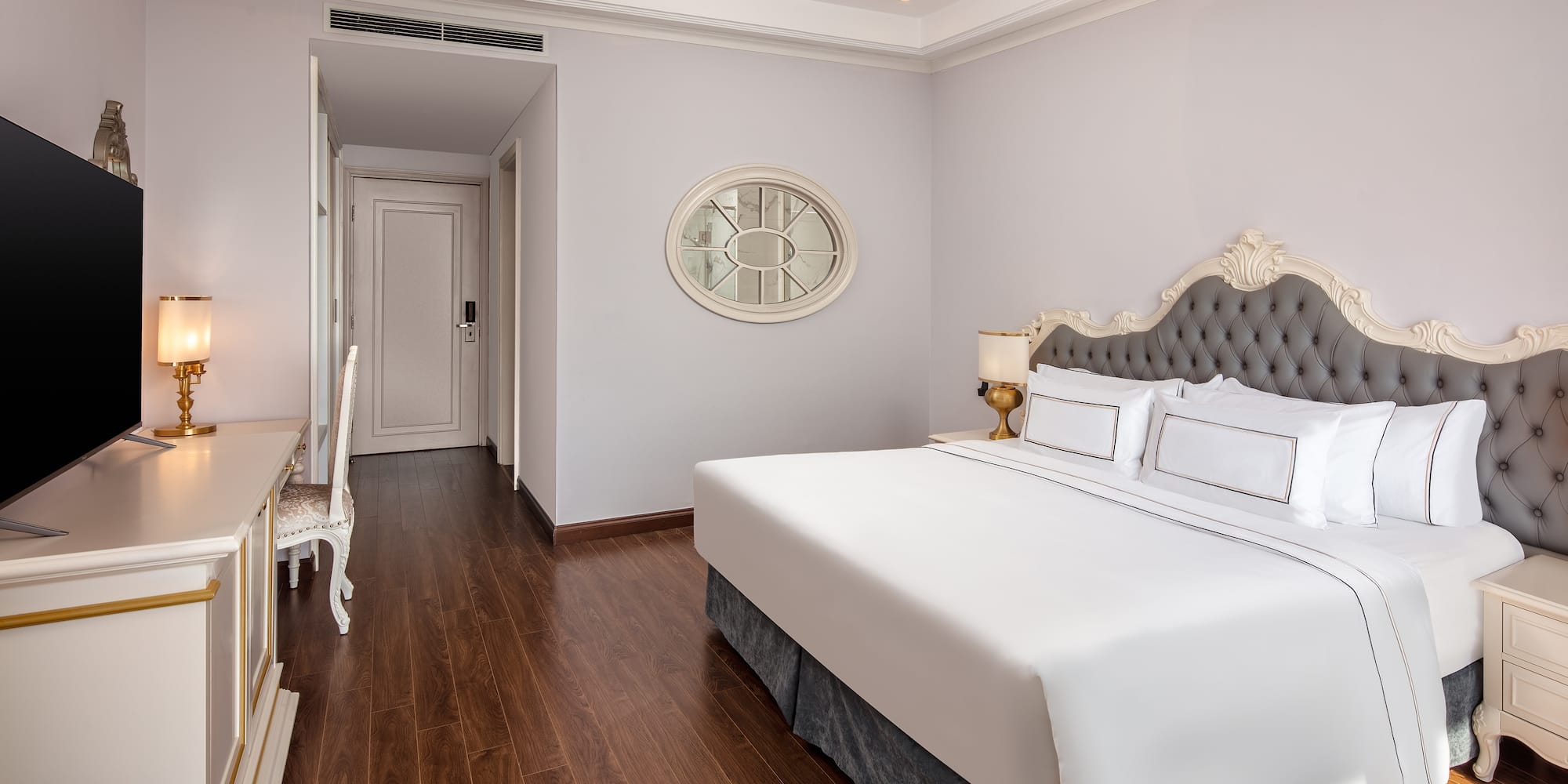 a bedroom with a bed and a desk