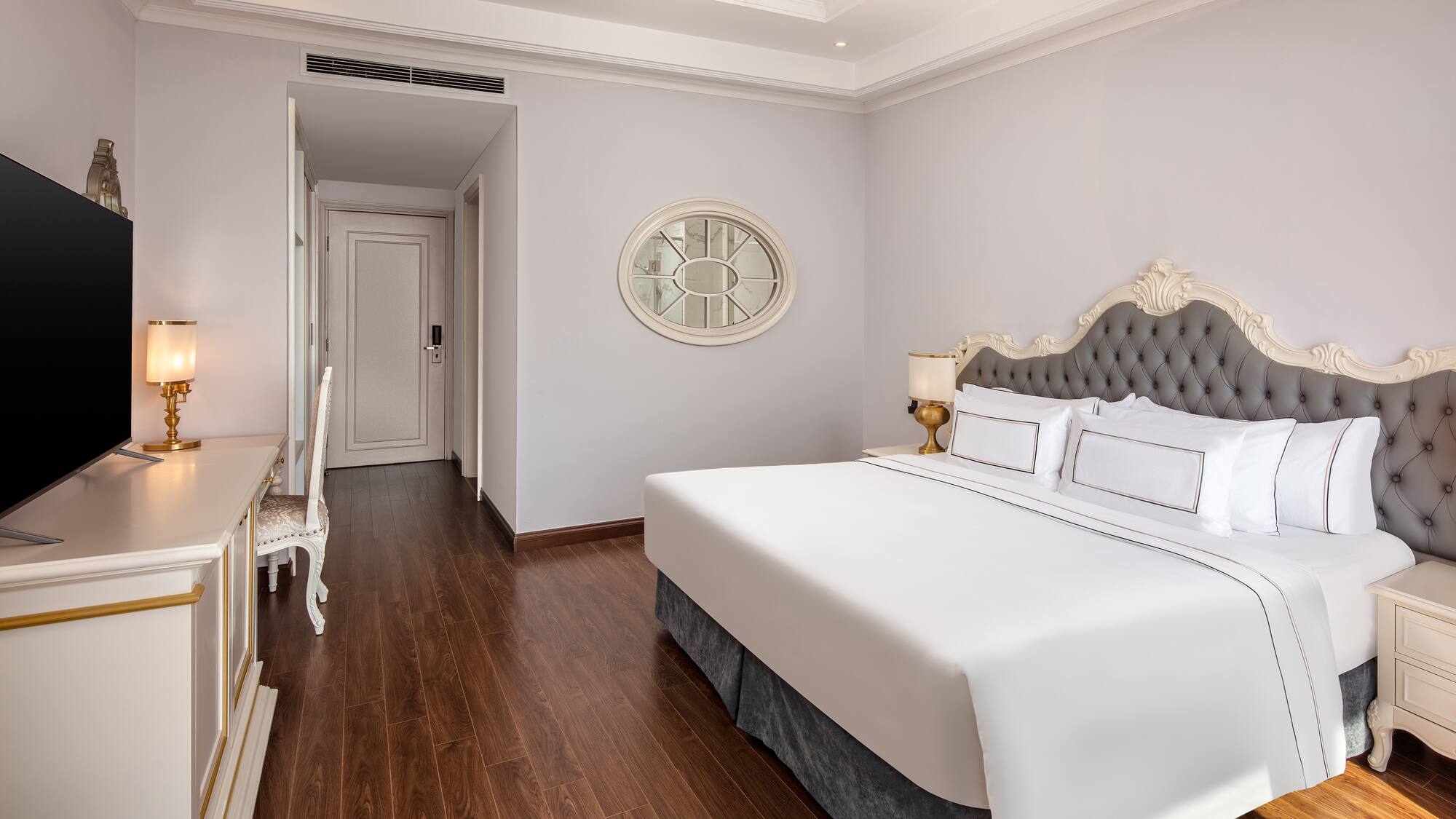 a bedroom with a bed and a desk